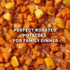 A close-up, top-down view of roasted sweet potatoes and regular potatoes, seasoned to perfection for a family dinner with Mccormick Toasted Onion And Garlic Seasoning Mix 1.25 Oz.