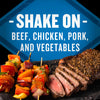 A blue sign with the words Shake On - Beef Chicken Pork and Vegetables over a plate of grilled steak and vegetables.