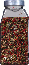 A glass jar filled with a mix of black white green and red peppercorns.