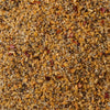 A close-up of a blend of spices including salt pepper garlic and red pepper flakes.