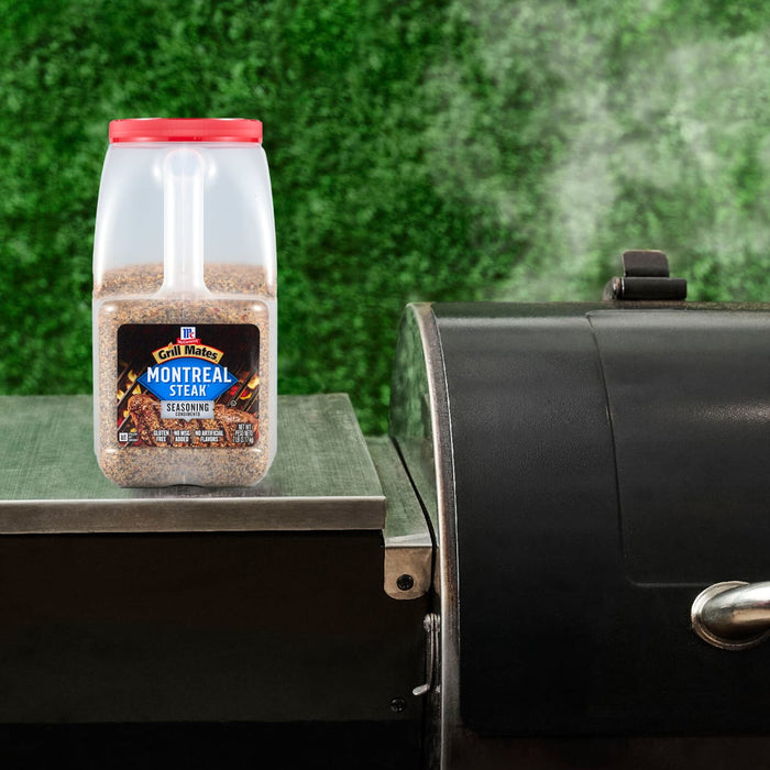 A container of Pit Boss Competition Blend wood pellets sits next to a smoker grill.