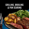 A delicious meal featuring grilled steak, roasted potatoes, and fresh greens, showcasing versatile cooking methods like grilling, broiling, and pan searing.