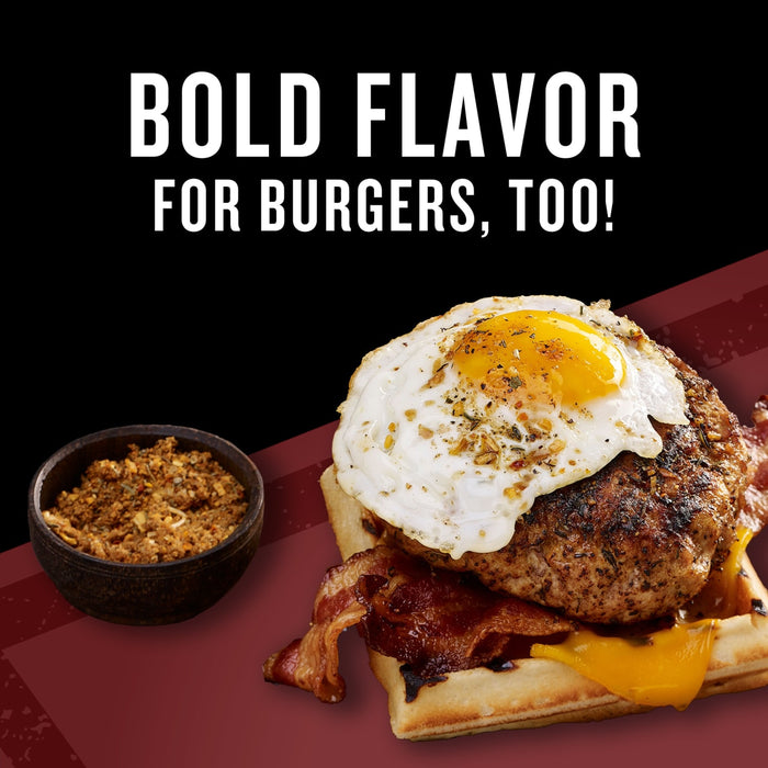 A burger with a fried egg on top bacon and cheese on a waffle next to a bowl of seasoning with the text Bold Flavor for Burgers Too!