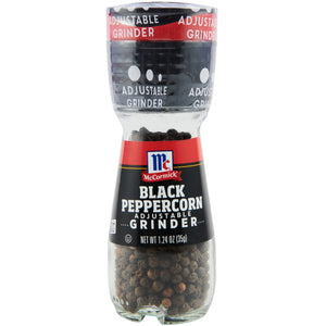 A McCormick Black Peppercorn Adjustable Grinder with black peppercorns inside.
