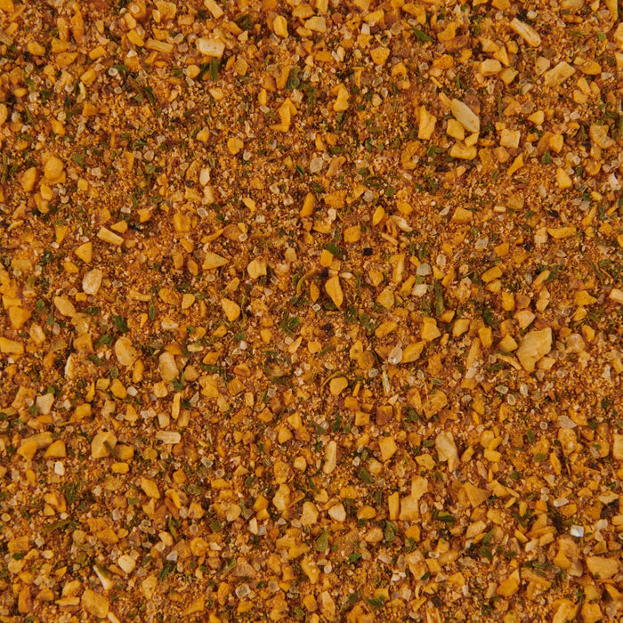 A close-up of a blend of spices including garlic herbs and salt.