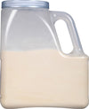 A clear plastic jug with a handle filled with a light beige powder.