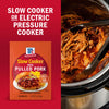 McCormick Slow Cooker BBQ Pulled Pork seasoning mix is displayed next to a slow cooker filled with pulled pork.