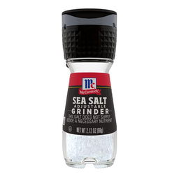 A McCormick Sea Salt Adjustable Grinder with a black lid and a glass jar filled with salt crystals.