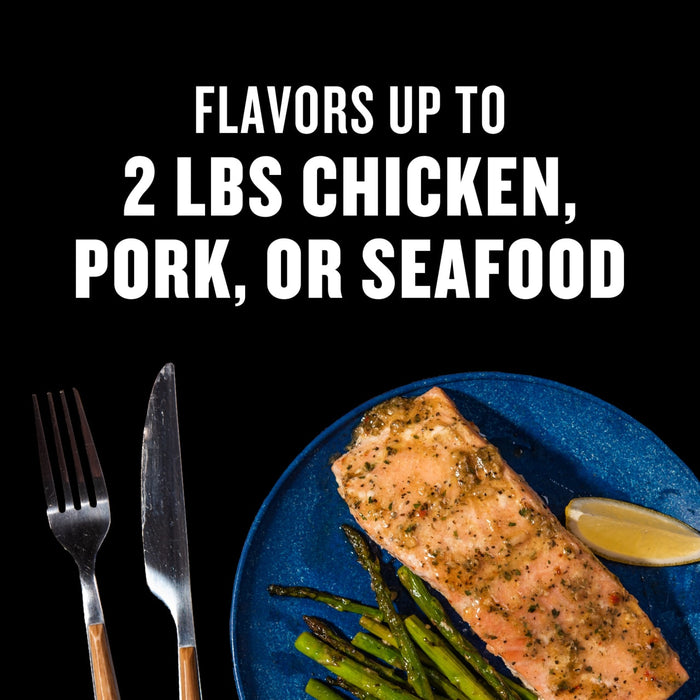 This image showcases a flavorful seafood dish with asparagus and lemon suitable for flavoring up to 2 lbs of chicken pork or seafood.