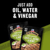 Two packets of McCormick Grill Mates Garlic Herb &amp; Wine 15 Minute Marinade Mix are displayed with the text Just Add Oil Water &amp; Vinegar above them.