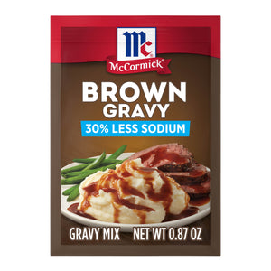 A packet of McCormick Brown Gravy Mix with 30% less sodium is displayed.