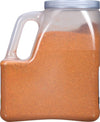 A plastic container filled with a brown spice blend.
