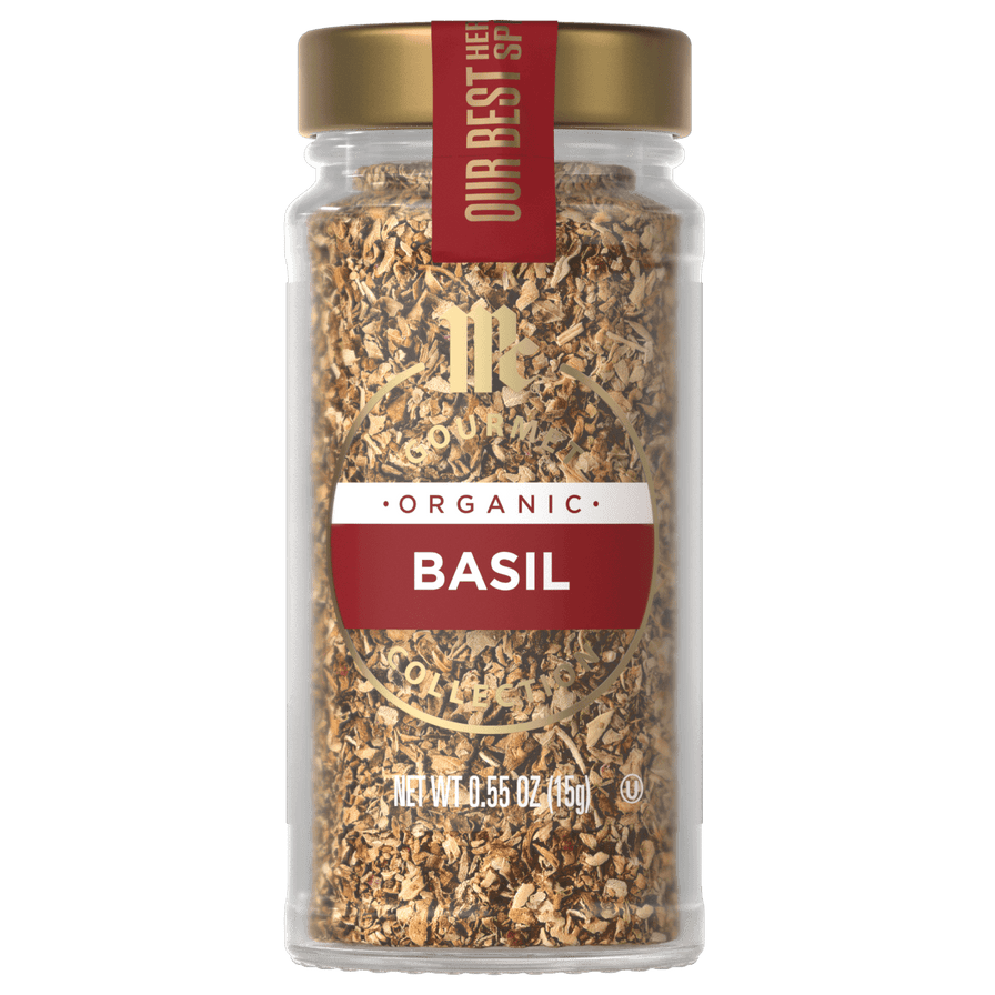 A glass jar of McCormick Gourmet Organic Basil.