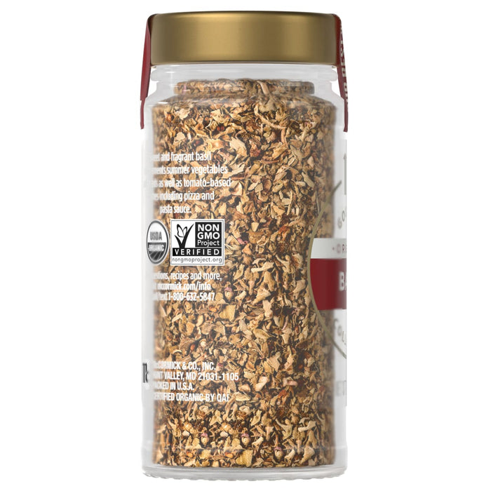 A bottle of McCormick Gourmet Organic Basil.