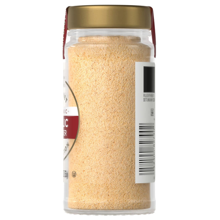 A jar of organic garlic powder with a gold lid and a label with a barcode.