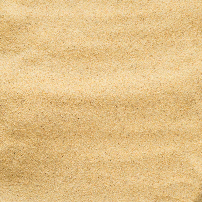 Close-up of rippled sand, evoking a sense of calm and natural texture.