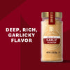 McCormick Culinary Garlic Powder is shown in a glass jar with a gold lid, set against a deep red background, emphasizing its deep, rich, garlicky flavor.