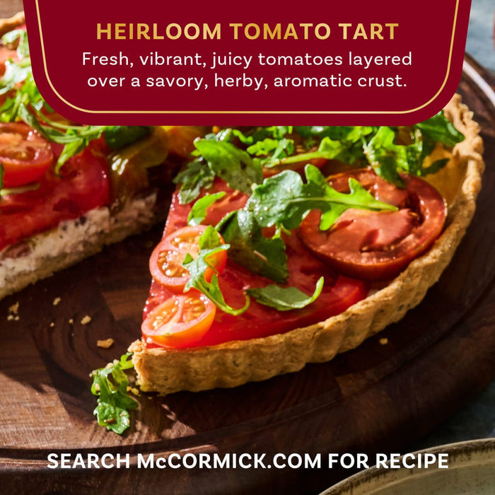 A vibrant Heirloom Tomato Tart from McCormick featuring fresh tomatoes layered over a savory crust.