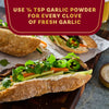 A close-up shot of a delicious sandwich with a tip about using 1/8 tsp of garlic powder for every clove of fresh garlic.