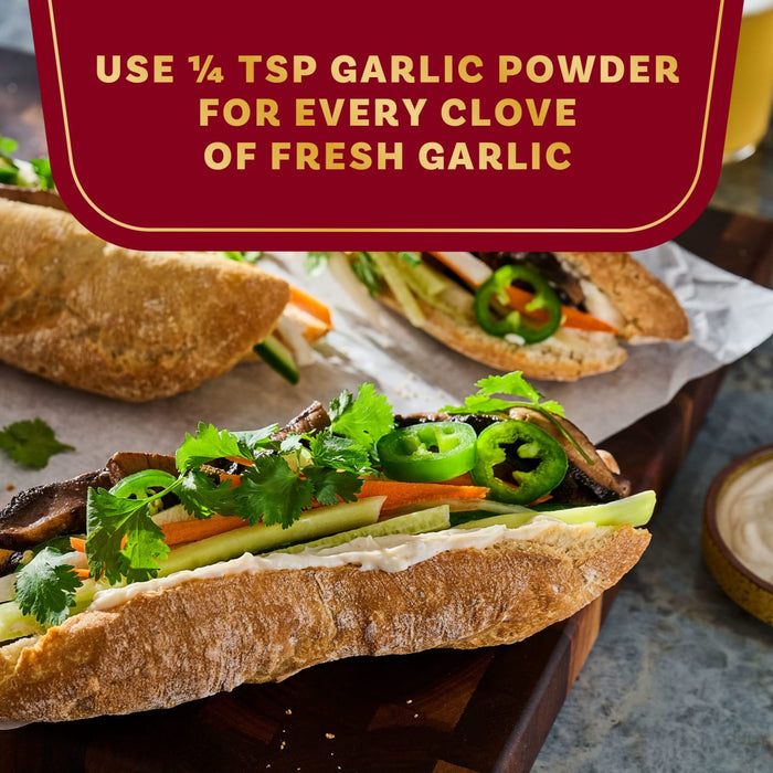 A close-up shot of a delicious sandwich with a tip about using 1/8 tsp of garlic powder for every clove of fresh garlic.