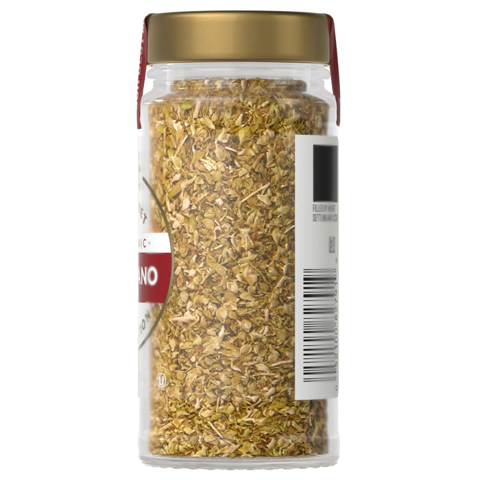 A jar of Simply Organic oregano is shown, filled with dried oregano leaves and topped with a gold lid.