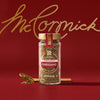 A jar of McCormick oregano is displayed against a red background with the McCormick logo in gold.