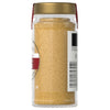 A jar of McCormick ground mustard is displayed showcasing its fine texture and golden color.
