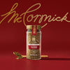A jar of McCormick's Montreal Steak Spice is displayed against a red background with the brand's signature script logo in gold.