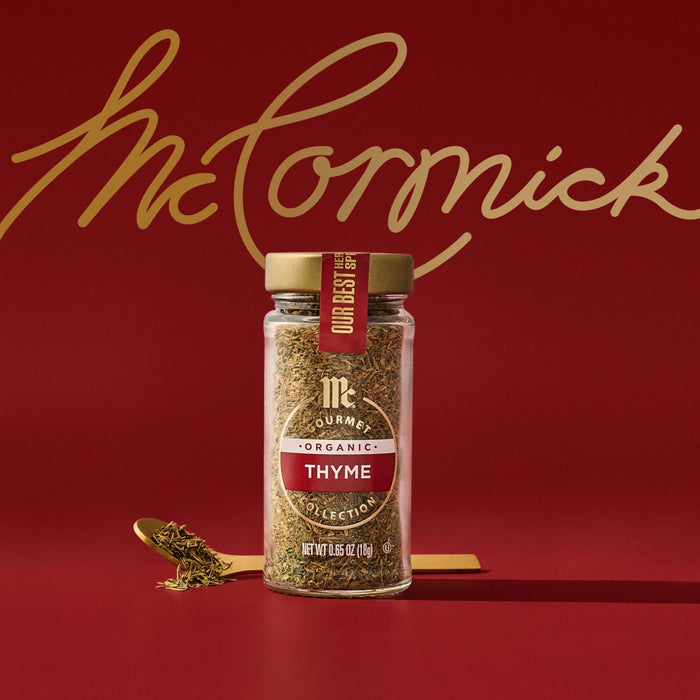 A jar of McCormick's Montreal Steak Spice is displayed against a red background with the brand's signature script logo in gold.