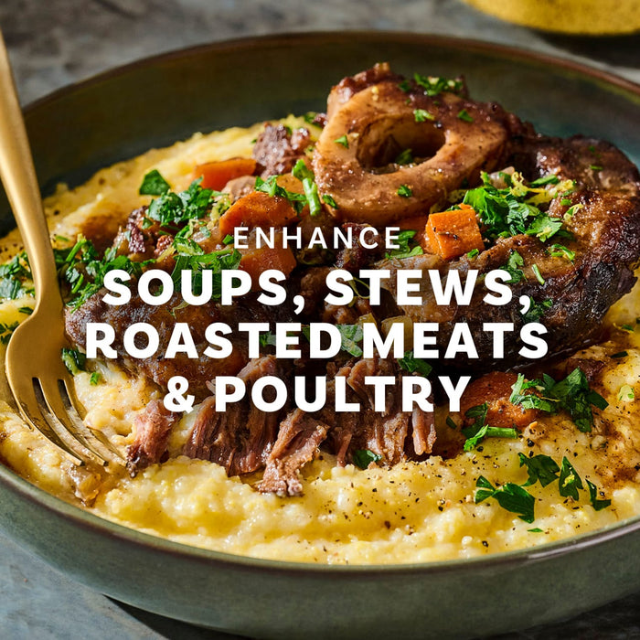 This image showcases a hearty dish of polenta topped with braised meat, vegetables, and herbs, highlighting its versatility in enhancing soups, stews, roasted meats, and poultry.