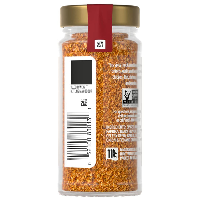 A jar of McCormick Cajun spice blend with a gold lid and a red label, featuring a non-GMO verified logo and ingredient list.
