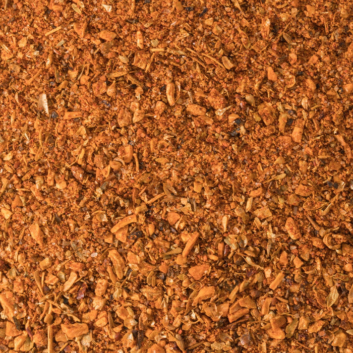 A close-up of a vibrant, reddish-brown spice blend.