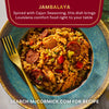 A bowl of McCormick Jambalaya, a spiced Cajun dish, is shown with sausage, chicken, and vegetables.