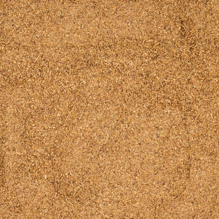 A close-up view of fine, golden-brown sand.