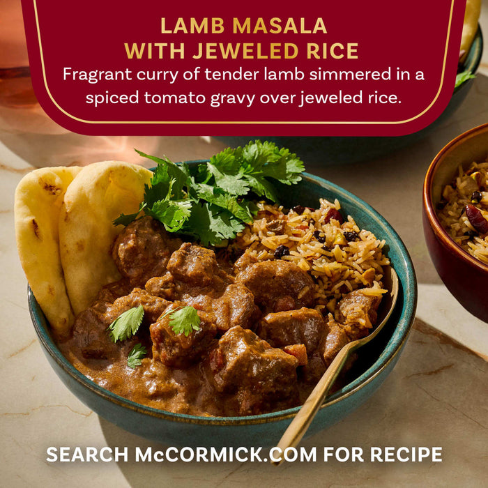 A bowl of McCormick Lamb Masala with Jeweled Rice is shown, featuring a fragrant curry of tender lamb simmered in a spiced tomato gravy over jeweled rice.