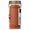 A jar of McCormick Chile powder is shown, highlighting its vibrant color and texture.