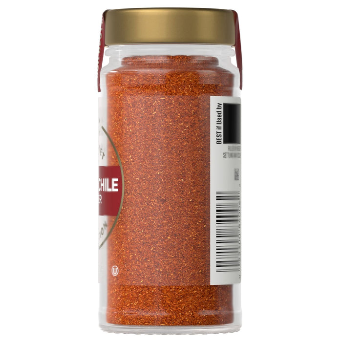 A jar of McCormick Chile powder is shown, highlighting its vibrant color and texture.