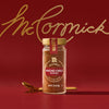 A jar of McCormick Culinary Chili Powder is displayed against a red background with the McCormick logo in gold.