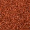 A textured surface with a consistent reddish-brown color, resembling fine granules or sand.