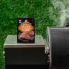A packet of McCormick Grill Mates Chipotle Pepper seasoning sits on a grill.