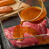 marinade being added to meat
