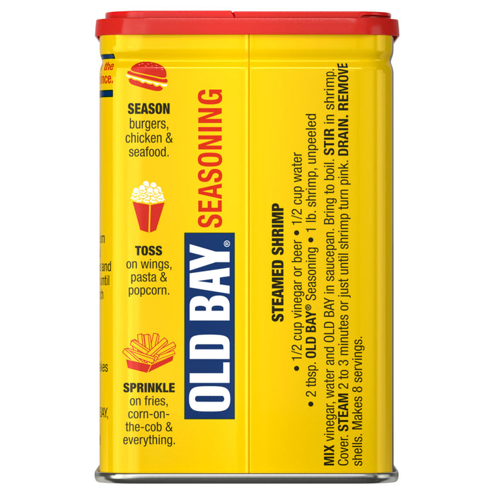 A yellow Old Bay seasoning container with a red lid.