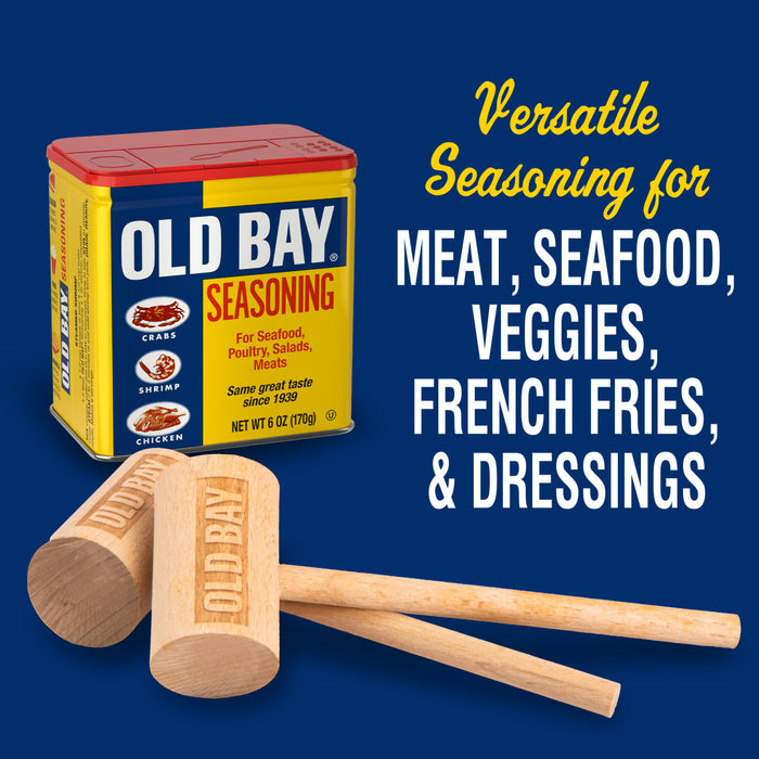 A can of Old Bay seasoning with two wooden mallets, one with the Old Bay logo on it.
