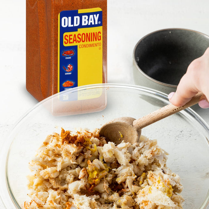 A bowl of crab meat seasoned with Old Bay seasoning.
