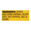 A yellow label with the ingredients for a spice blend including paprika celery seed red pepper salt and sugar.