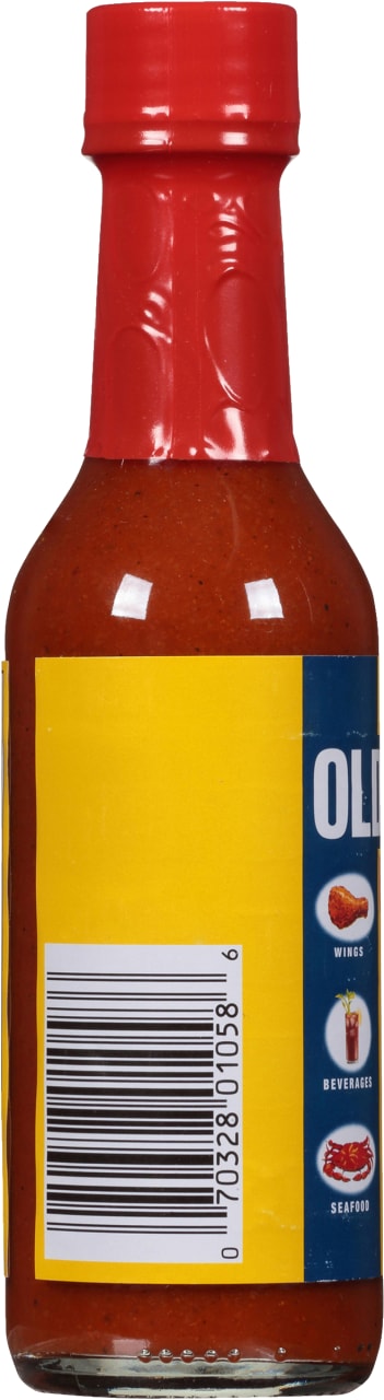 A bottle of Old Bay hot sauce with a yellow label and a barcode.