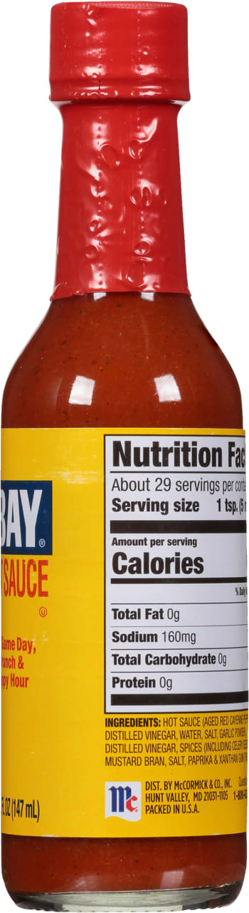A bottle of McCormick Bay Sauce with nutritional information and ingredients listed on the label.