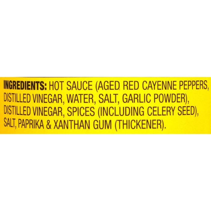 A yellow label with the ingredients for a hot sauce.