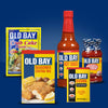 A collection of Old Bay products including crab cake mix, seasoned coating mix, hot sauce, cocktail sauce, and seasoning.