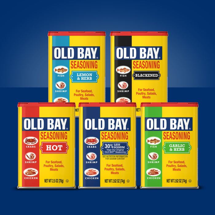 A variety of Old Bay Seasoning flavors are displayed in their iconic yellow cans.